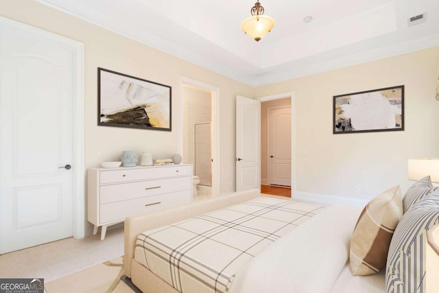 bedroom with visible vents, baseboards, light colored carpet, ornamental molding, and a tray ceiling