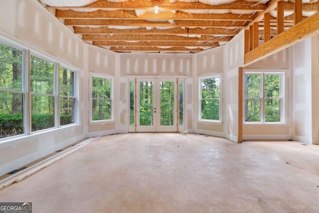 unfurnished sunroom with plenty of natural light