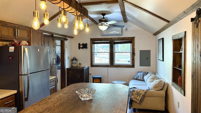 kitchen with lofted ceiling with beams, a ceiling fan, freestanding refrigerator, open floor plan, and electric panel