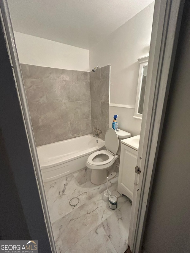 bathroom with toilet, marble finish floor, bathtub / shower combination, and vanity