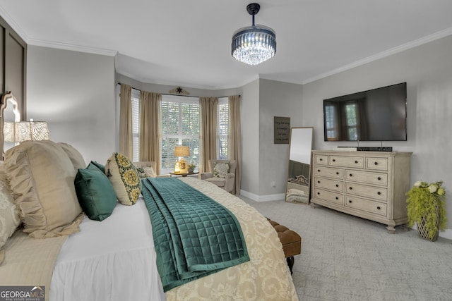 bedroom featuring baseboards, light carpet, a notable chandelier, and crown molding