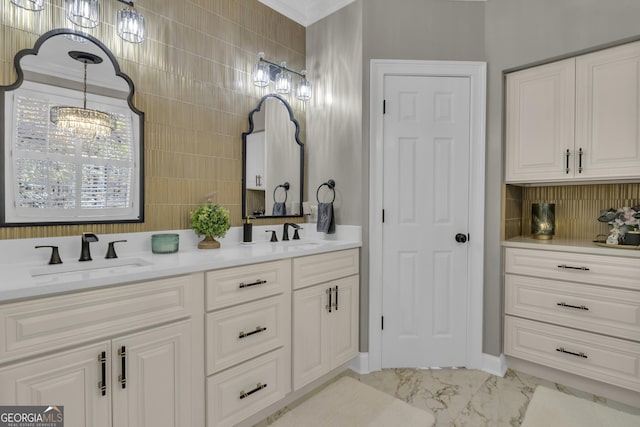 bathroom featuring a sink, tasteful backsplash, marble finish floor, and double vanity