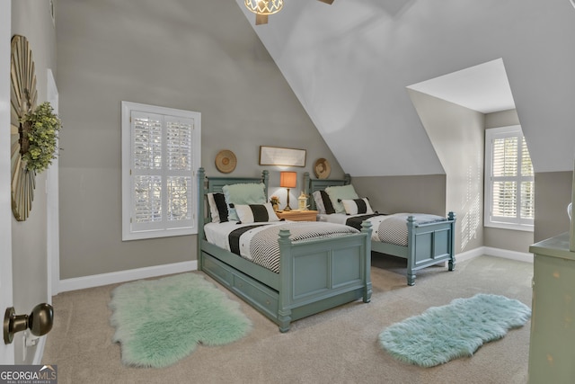 bedroom with carpet flooring, lofted ceiling, and baseboards