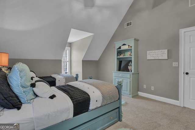 bedroom featuring vaulted ceiling, carpet flooring, visible vents, and baseboards