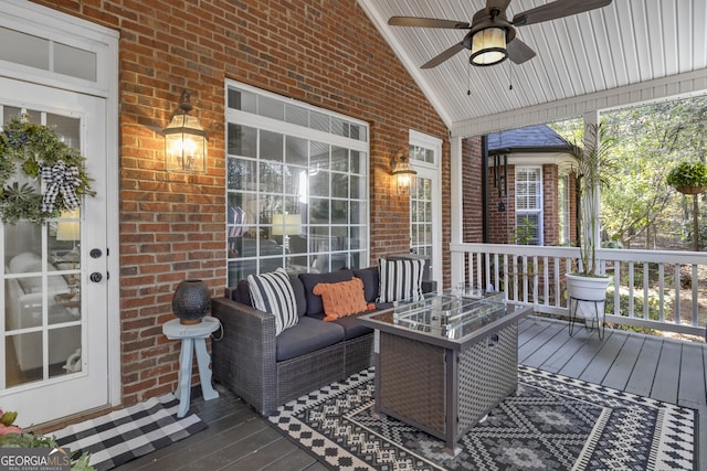 wooden terrace featuring ceiling fan and an outdoor hangout area