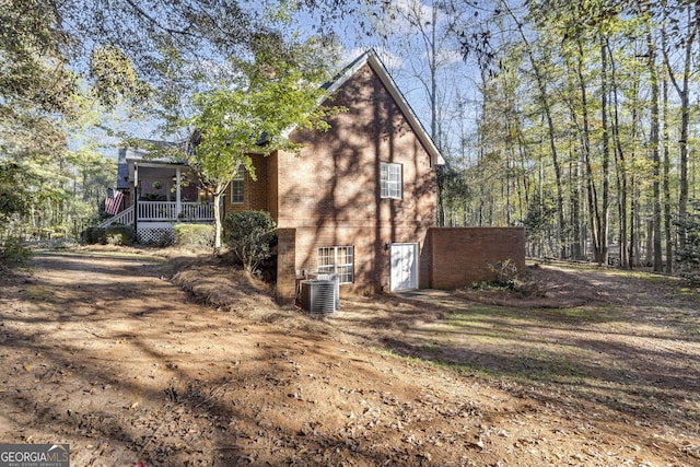 view of side of home featuring brick siding