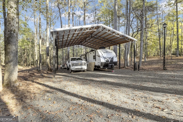 view of car parking featuring a carport and driveway