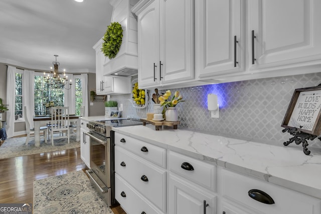 kitchen featuring custom exhaust hood, dark wood-style floors, white cabinets, and stainless steel range