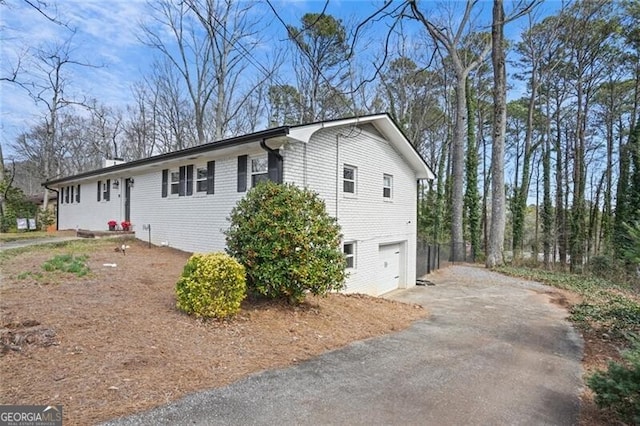 view of front of home with a garage and driveway