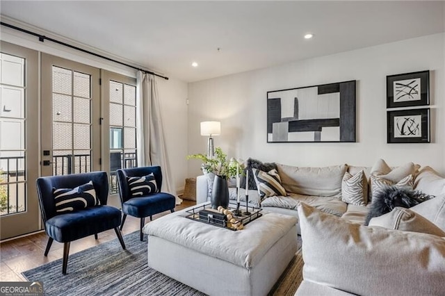 living area with dark wood-style floors and recessed lighting