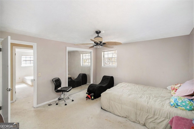 bedroom featuring carpet floors, a ceiling fan, baseboards, and a closet