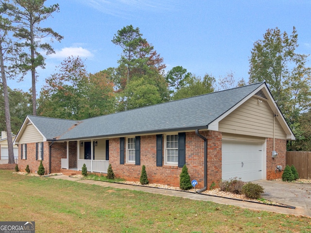 ranch-style house featuring a garage, a porch, a front yard, and brick siding