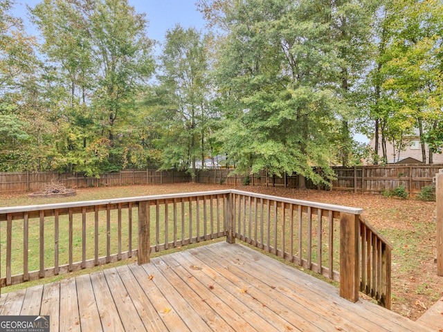 deck featuring a fenced backyard and a yard