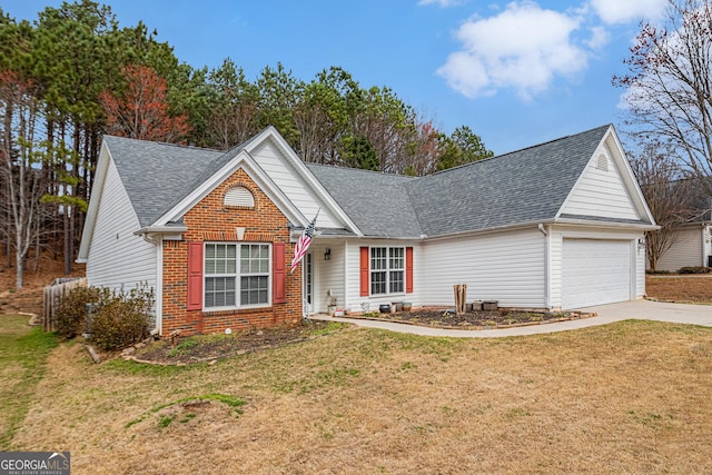 view of front of property with a garage, brick siding, a front yard, and a shingled roof