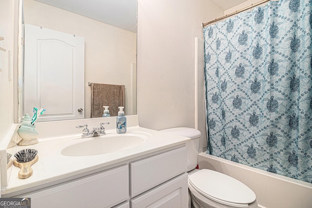 bathroom featuring shower / tub combo, vanity, and toilet