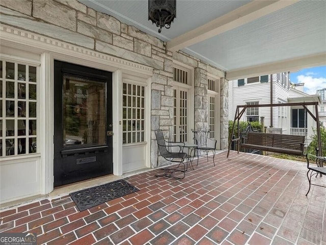 entrance to property with stone siding