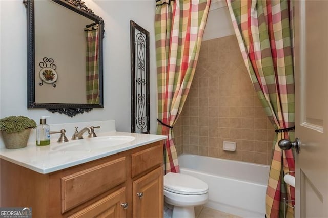 bathroom with shower / tub combo, vanity, and toilet