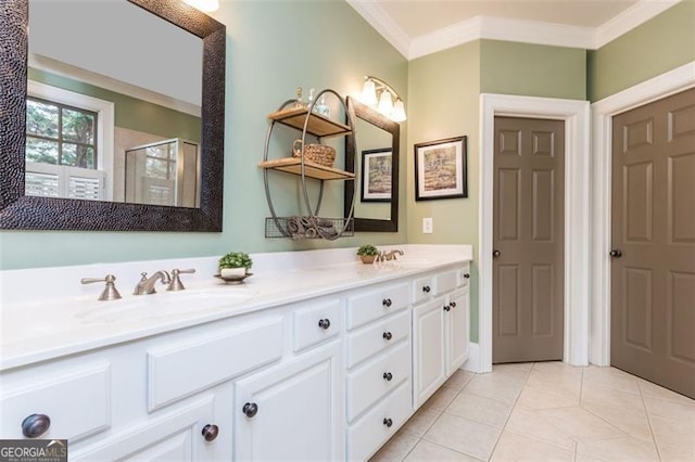 full bathroom featuring a stall shower, crown molding, a sink, and tile patterned floors