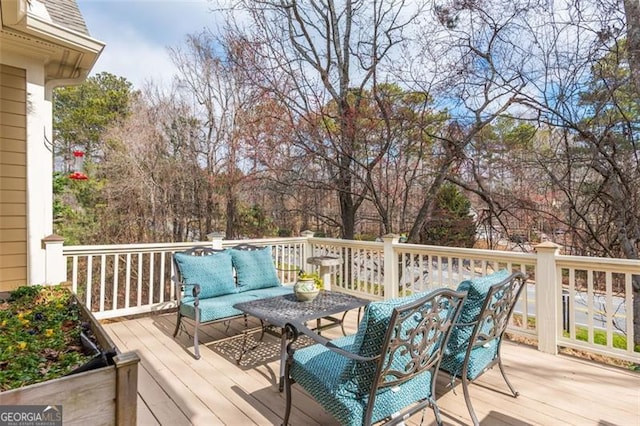 wooden deck with an outdoor hangout area