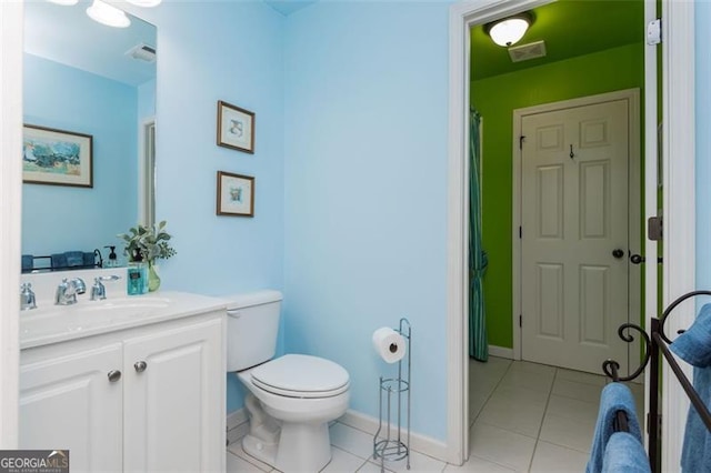 bathroom with vanity, tile patterned flooring, visible vents, toilet, and baseboards