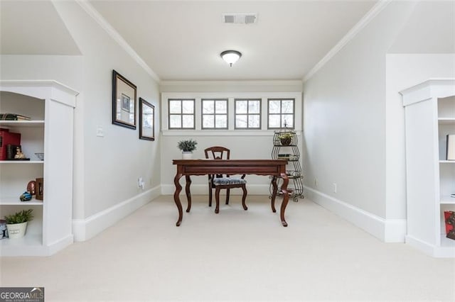 carpeted home office with visible vents, crown molding, and baseboards