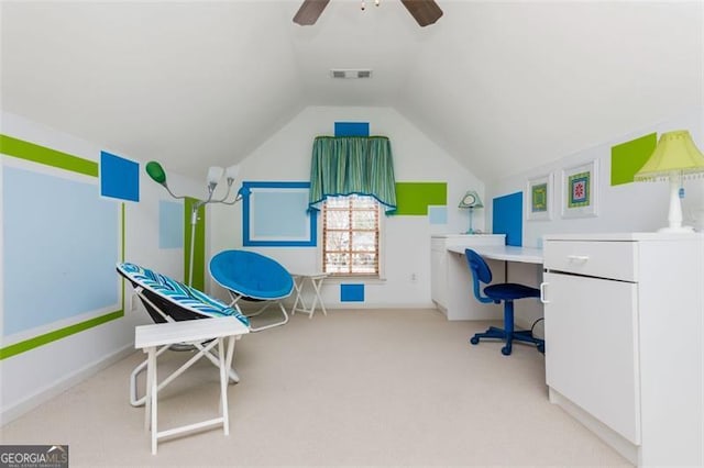 office with visible vents, ceiling fan, carpet, and vaulted ceiling