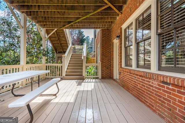 wooden deck featuring stairs