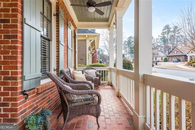 balcony featuring covered porch and ceiling fan