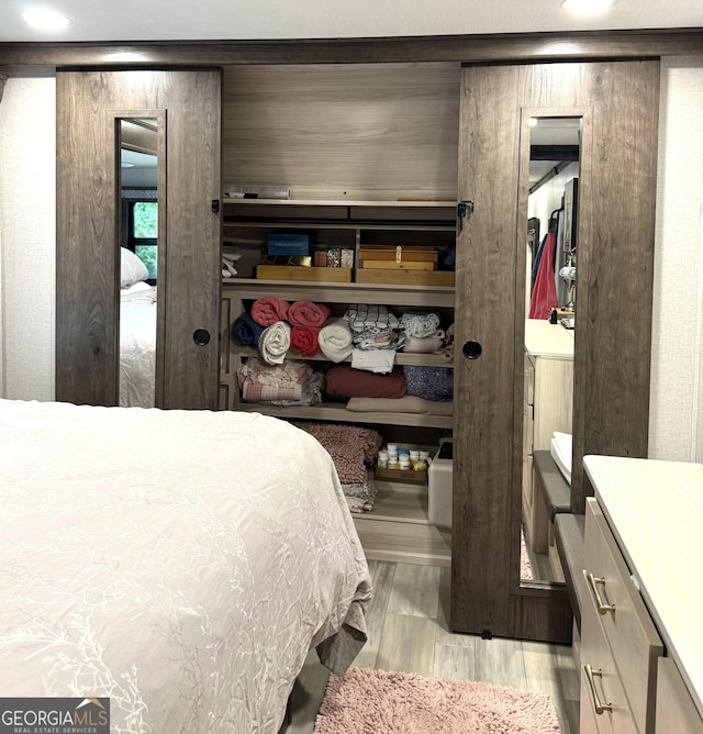 bedroom with light wood-type flooring