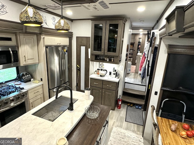 kitchen with stainless steel appliances, dark brown cabinets, light countertops, and glass insert cabinets