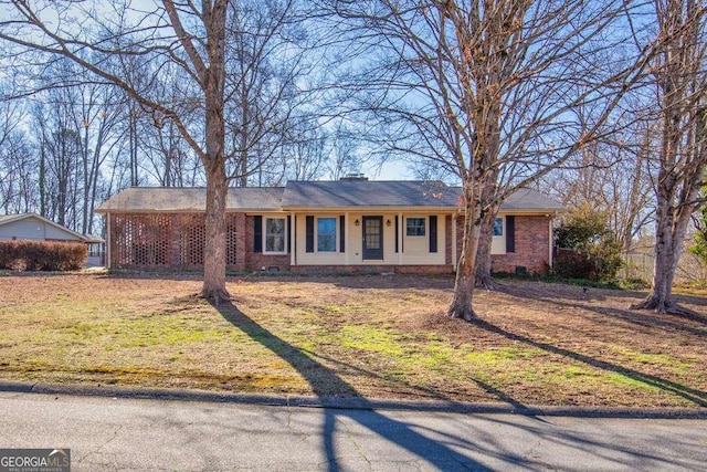 single story home with crawl space, a front lawn, and brick siding