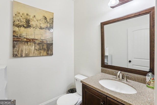 half bath with toilet and vanity