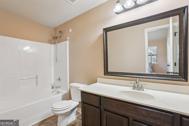 bathroom featuring toilet, shower / bathtub combination, and vanity