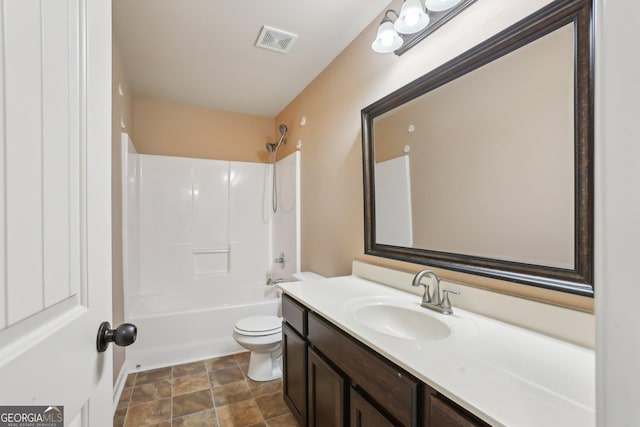 bathroom featuring toilet, tub / shower combination, vanity, and visible vents