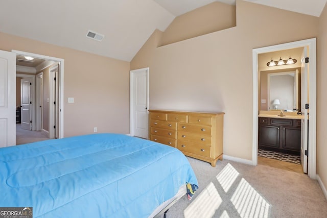 bedroom featuring lofted ceiling, connected bathroom, light colored carpet, visible vents, and baseboards