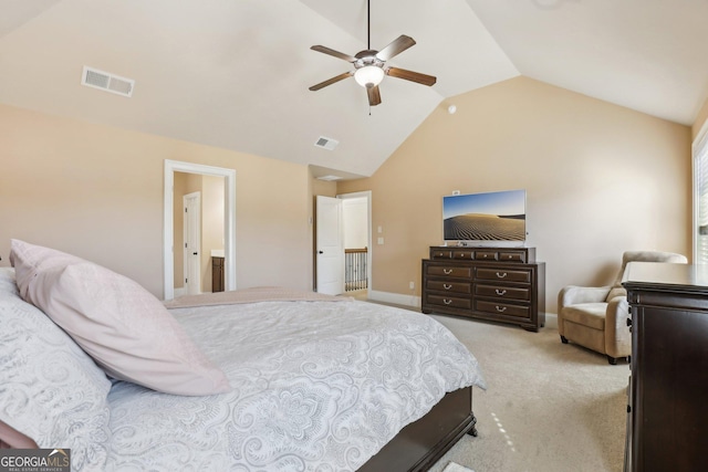 bedroom featuring baseboards, visible vents, vaulted ceiling, and light colored carpet