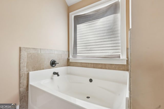 bathroom featuring a garden tub