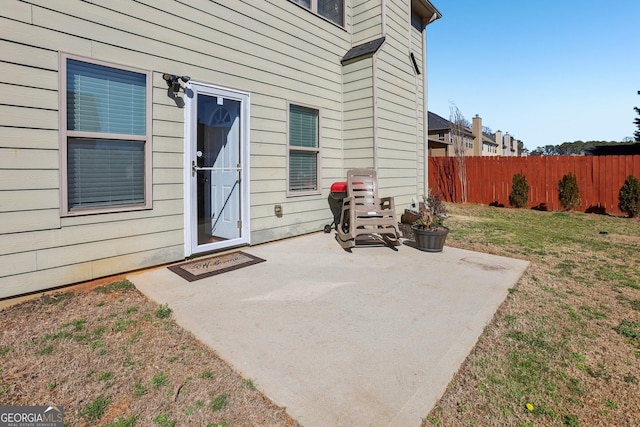 view of patio featuring fence