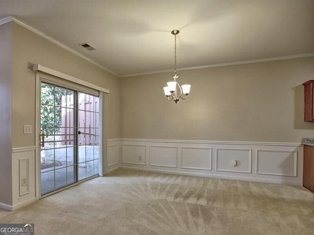 unfurnished dining area with light carpet, crown molding, visible vents, and an inviting chandelier