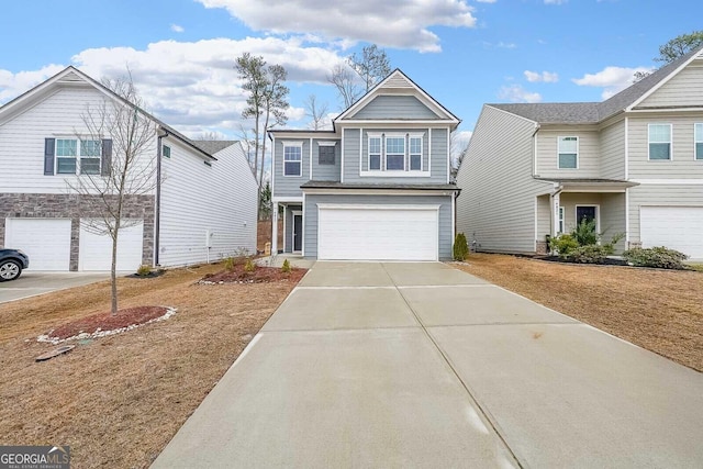 view of front facade with a garage and concrete driveway