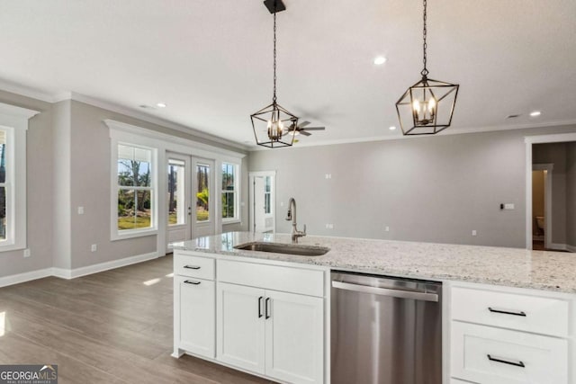 kitchen featuring a sink, white cabinetry, stainless steel dishwasher, and hanging light fixtures