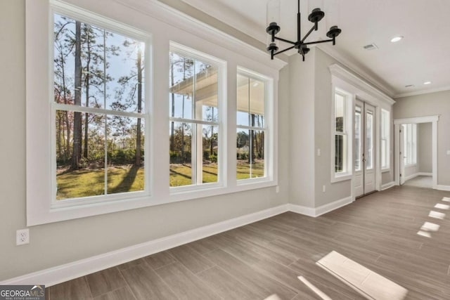 unfurnished sunroom with a chandelier and visible vents