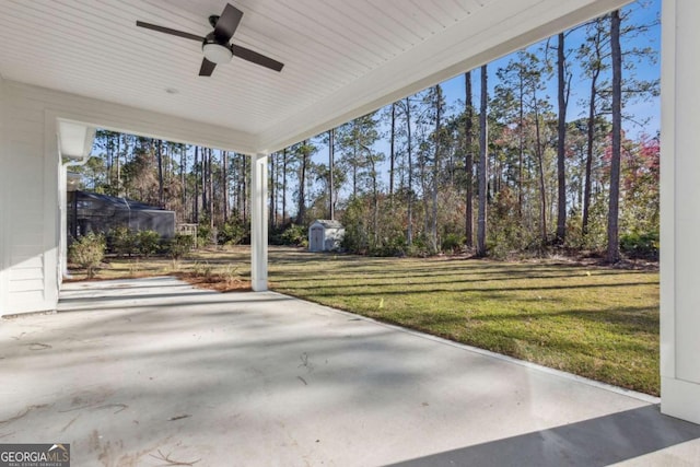 view of patio / terrace with ceiling fan and a storage unit