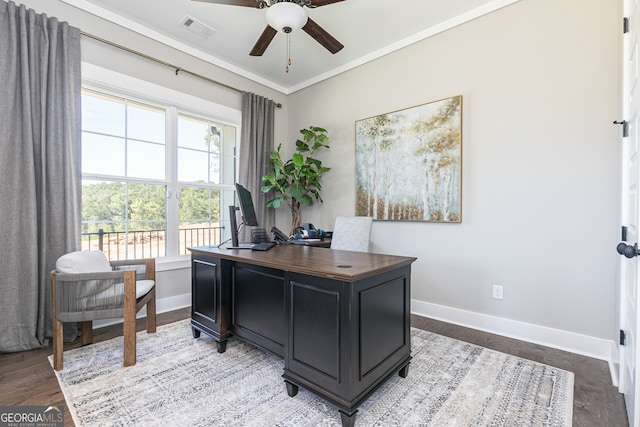 office space featuring ceiling fan, light wood-style flooring, visible vents, baseboards, and ornamental molding