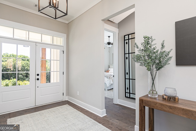 entrance foyer with dark wood-type flooring, french doors, and baseboards