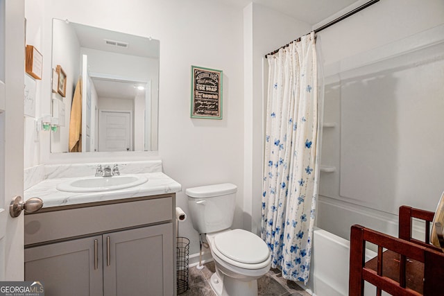 bathroom with toilet, shower / tub combo, visible vents, and vanity