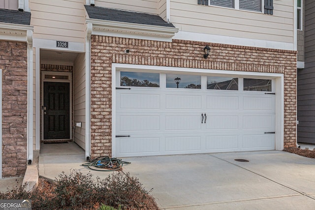 garage featuring driveway