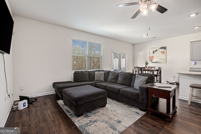 living room featuring dark wood-style floors, ceiling fan, recessed lighting, and baseboards