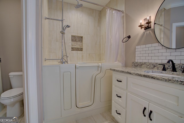 bathroom with shower / bath combination with curtain, toilet, backsplash, and vanity