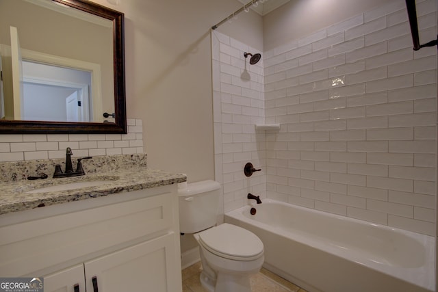 bathroom with toilet, vanity, decorative backsplash, and shower / bathtub combination